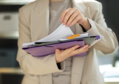young-adult-organizing-documents-min